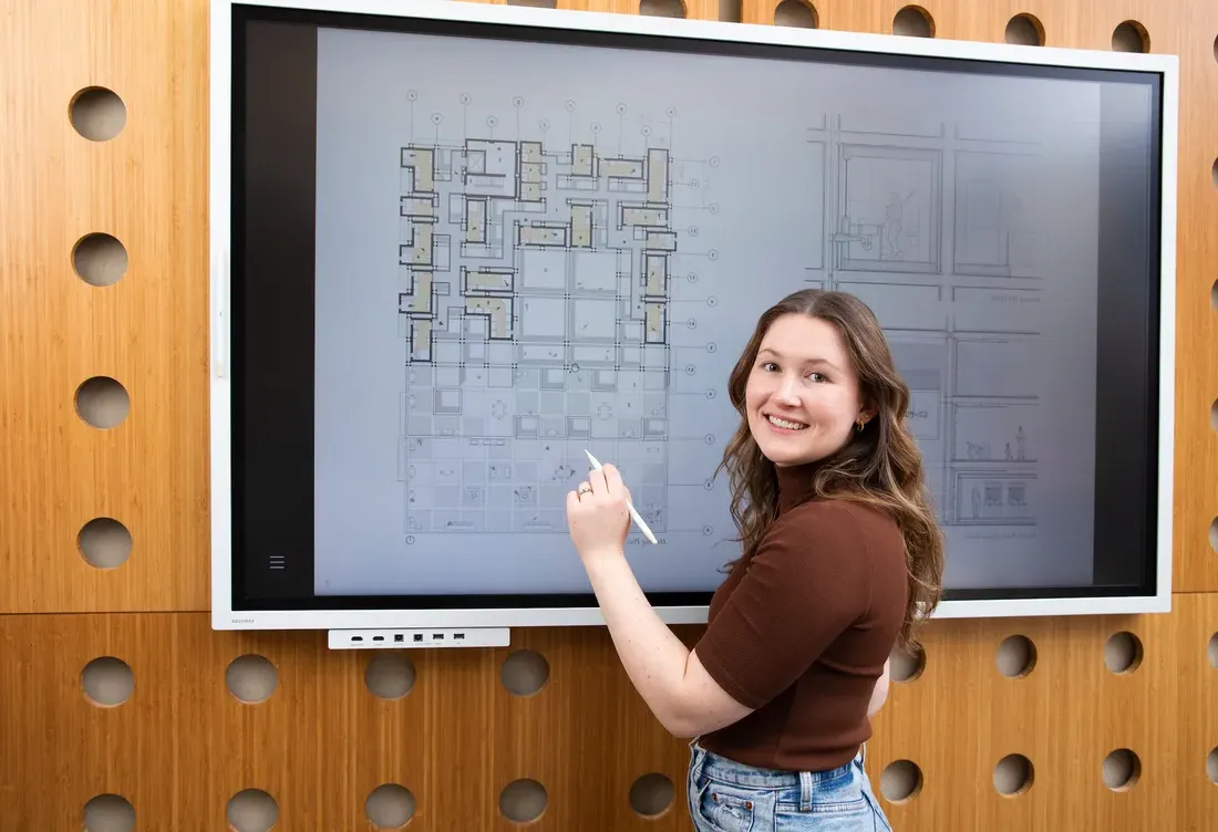 Person drawing on a board.